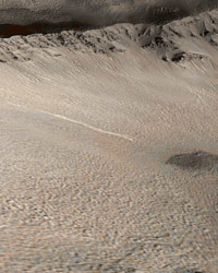 This picture is a  colorized view of the light-toned gully deposit as viewed from an oblique perspective, draped over topography derived from Mars Global Surveyor's Mars Orbiter Laser Altimeter data.